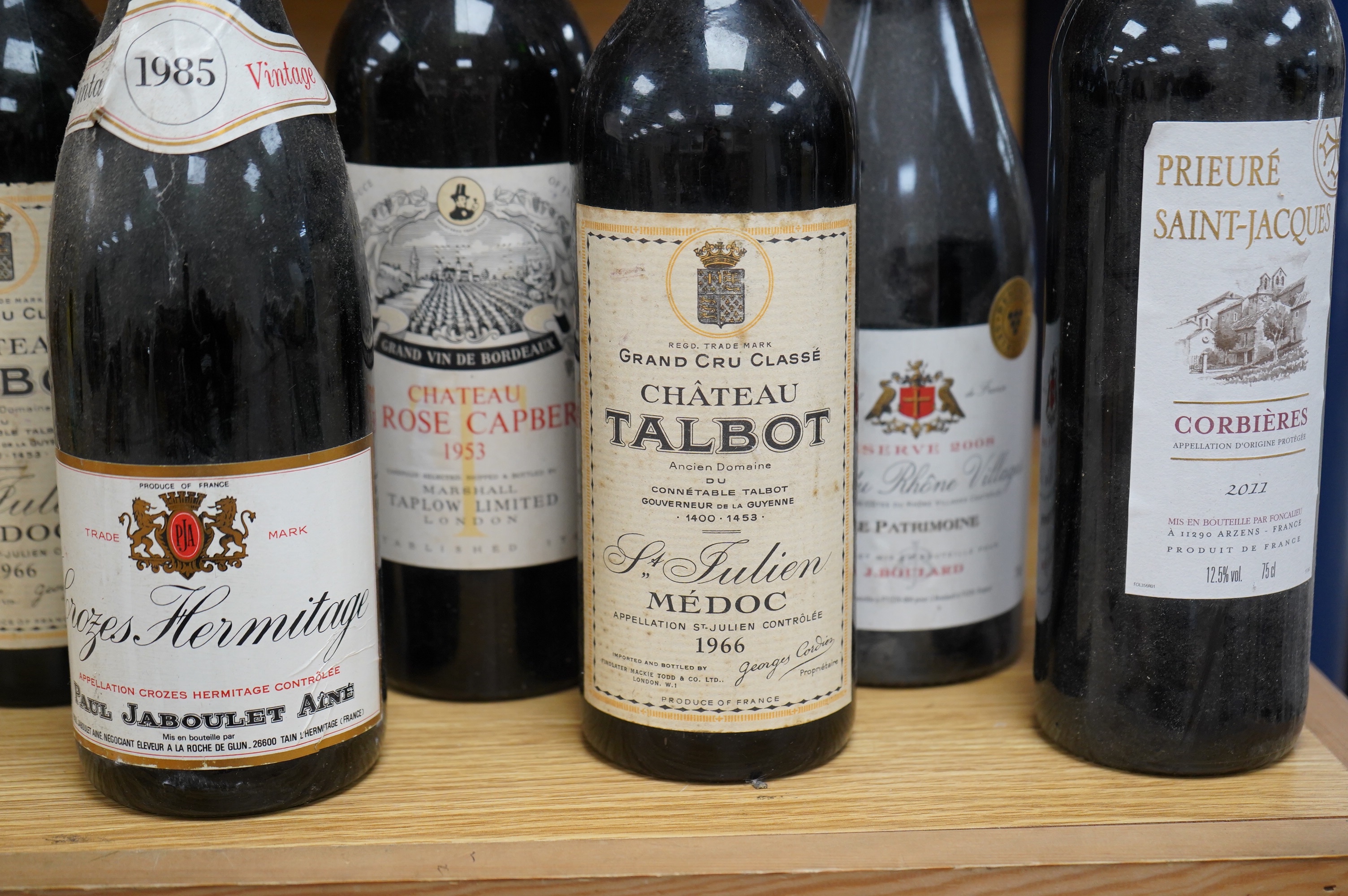 Six bottles of wine comprising two bottles of Chateau Talbot St Julien Medoc grand Cru 1966, one bottle of Chateau La Rose Capbern, Bordeaux 1953, one bottle of Crozes Hermitage vintage 1985, one bottle of Prieure Saint-